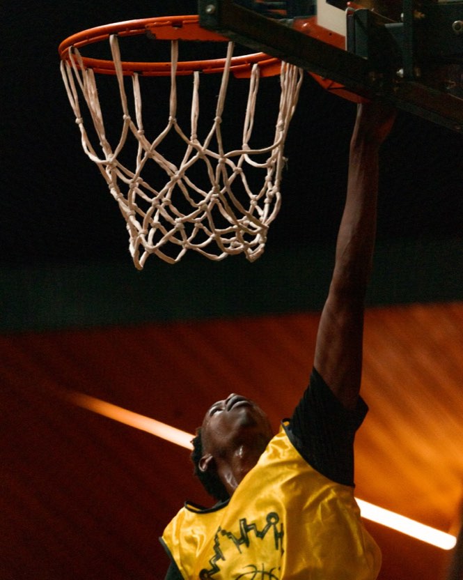 Young player scoring a layup in an organized game